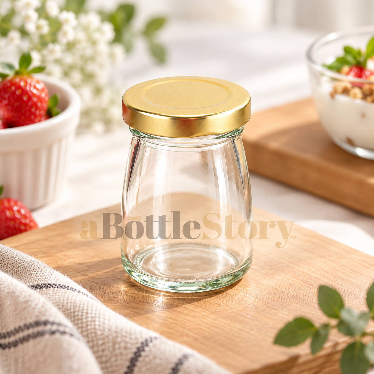 Gold-Lidded Clear Glass Jar Product Shot